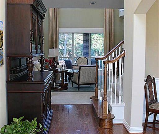 Soaring 2-story Entryway w/pretty hardwood flooring