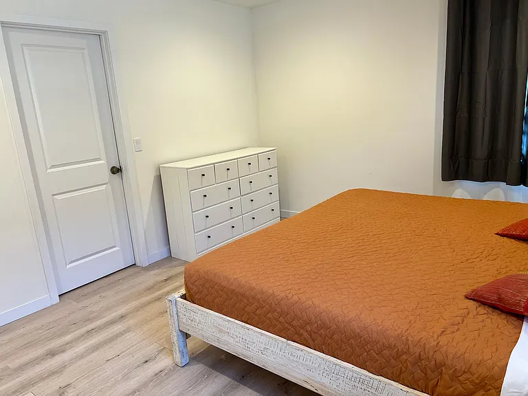 master bedroom with a king, memory foam mattress, and large walk-in closet