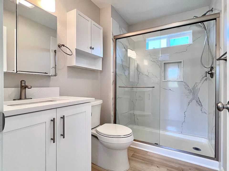 Full bathroom, upright shower.