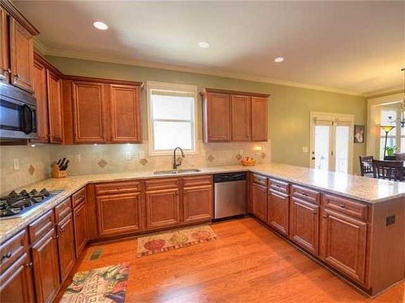Gourmet's Delight kitchen features designer tile b