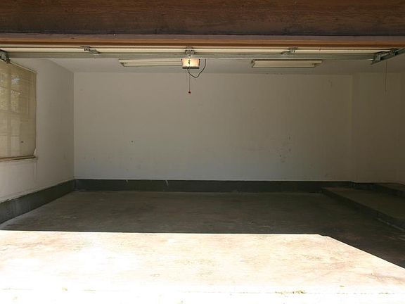 This oversize garage is almost 19' wide and 23' feet deep with a workbench type area to one side.