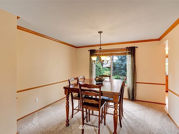 Formal dining room overlooks the lovely back yard.