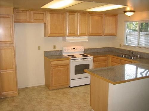Granite counter tops and new flooring in spacious kitchen w/