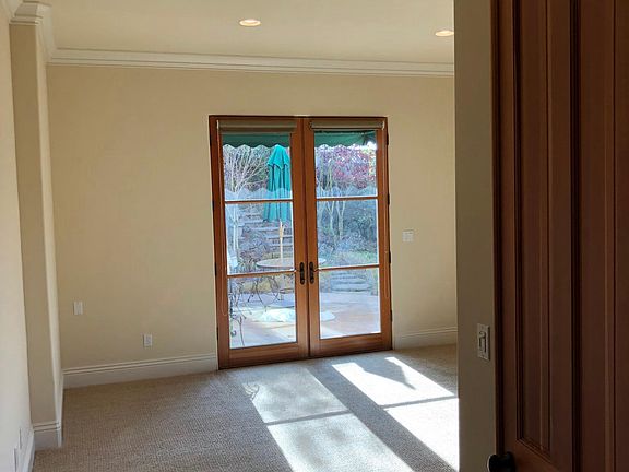Extra room, can be used as a den or 3rd bedroom. French door