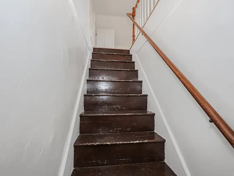 Back stairs leading to bonus room