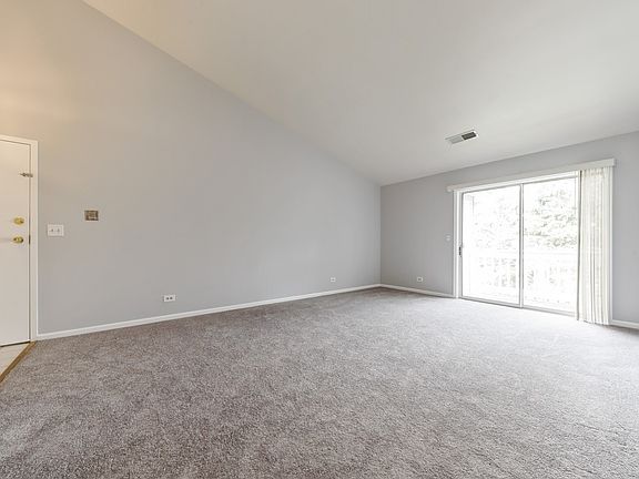 Living Room with vaulted ceiling and tons of light from slider