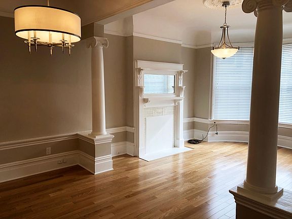 Notice the beautiful red oak hardwood floors.