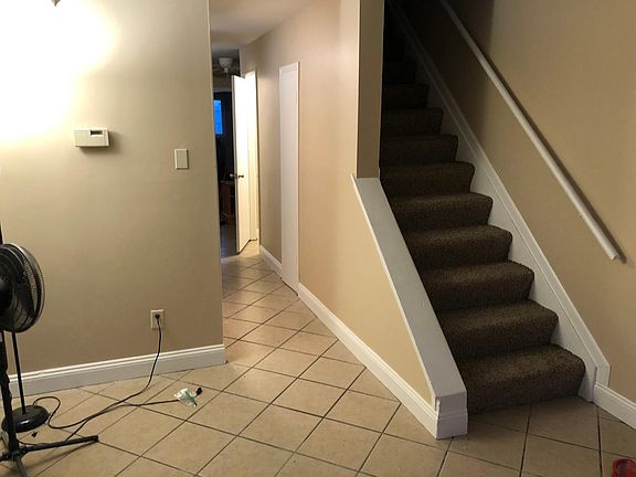 Living room that leads to stairs