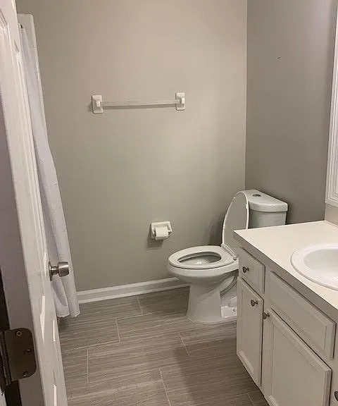 Second bedroom with tub and new floors