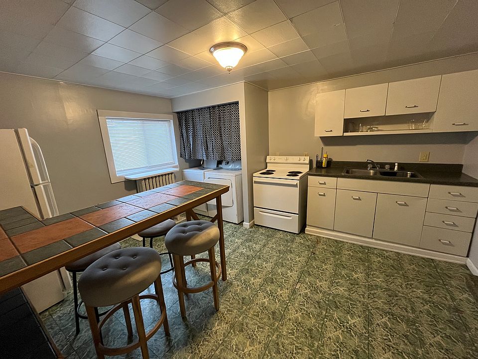 Kitchen, dining, and laundry area