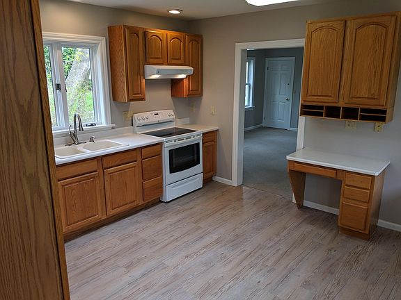 Very large eat-in kitchen with new flooring. Includes garbage disposal and dishwasher.
