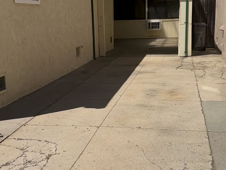 Entrance to in-law is through the garage. Garage and driveway parking belong to unit.