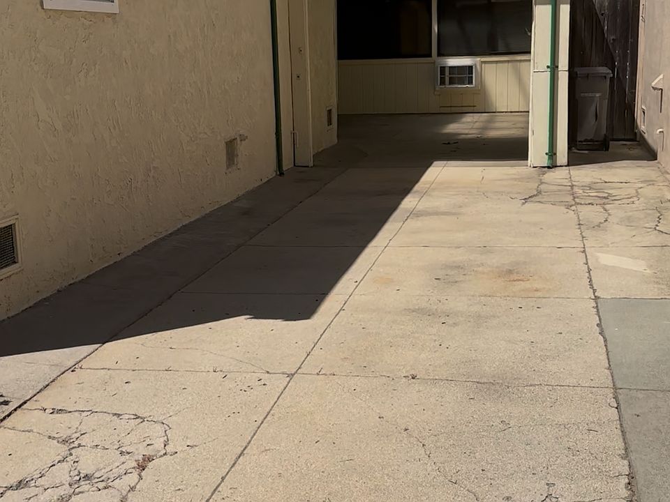 Entrance to in-law is through the garage. Garage and driveway parking belong to unit.