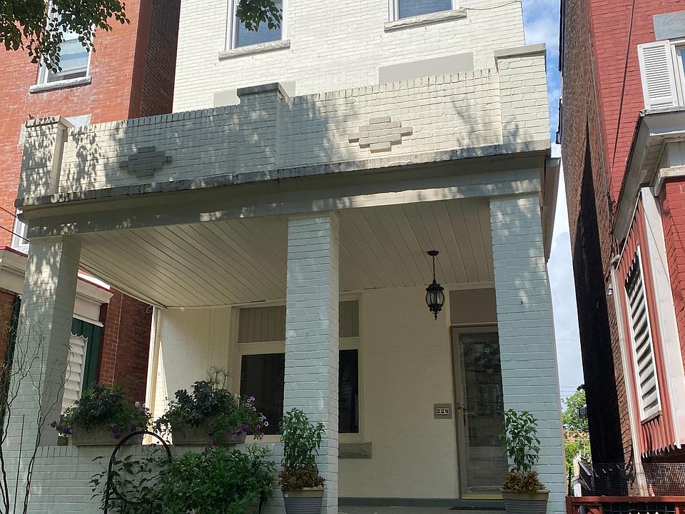 Front of house and glimpse of gardens