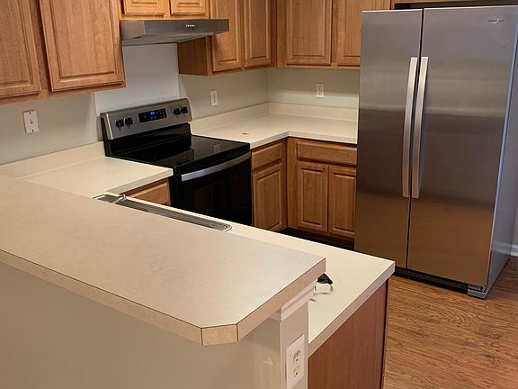 Bright kitchen adjacent to patio for great entertaining!