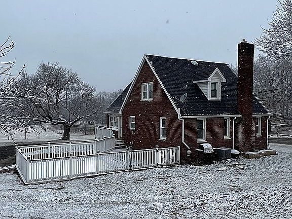 Rear view of yard and porch 
