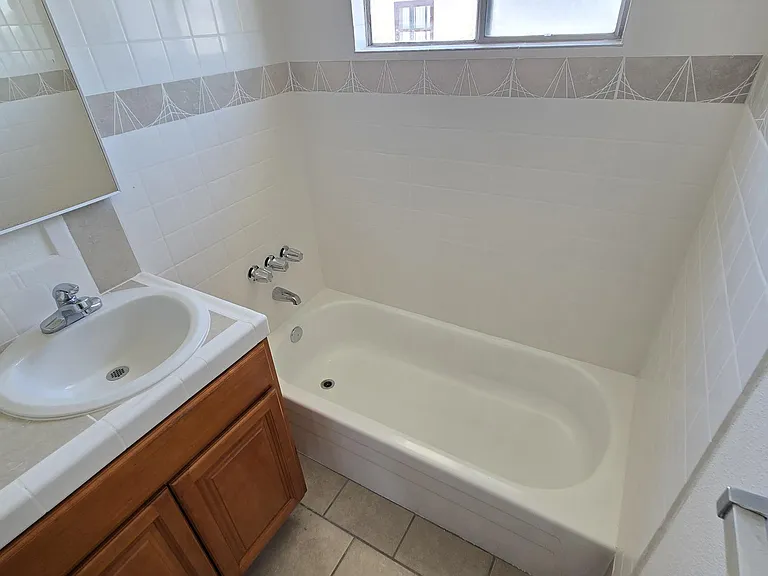 Newly tiled tub surrounds.