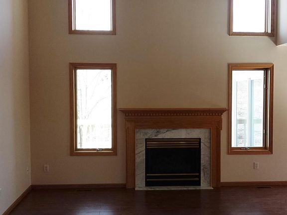 Vaulted ceiling in great room with fireplace