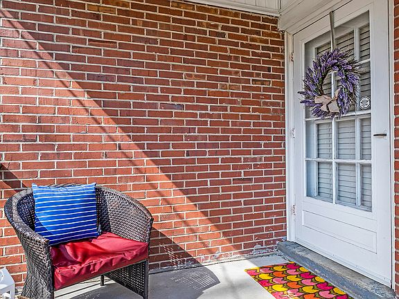 Lovely covered front porch with space for seating