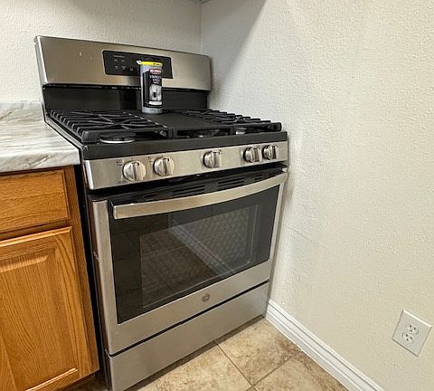 New stainless gas range and new hood