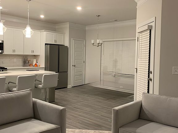 Spacious kitchen and dining area with island seating and an open layout designed for everyday living.