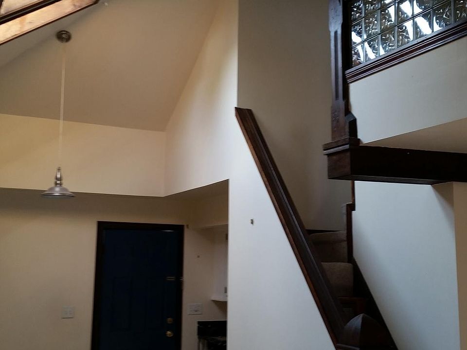 Back door to deck and stairs to loft bedroom