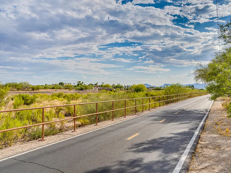 The Loop _ Tucson's renowned bike and pedestrian trail system, featuring 130+ miles of paved paths, including a 55_mile car_free loop encircling the city. The community has several private gates to the The Loop.