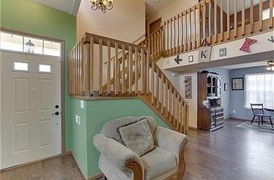 Two-story entryway greets you with light.