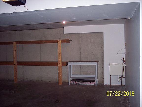 The garage has, openers, storage and deep sink.