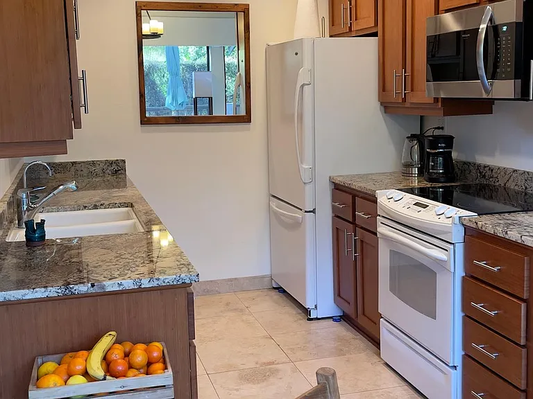 The kitchen easily accommodates a cook and a helper.