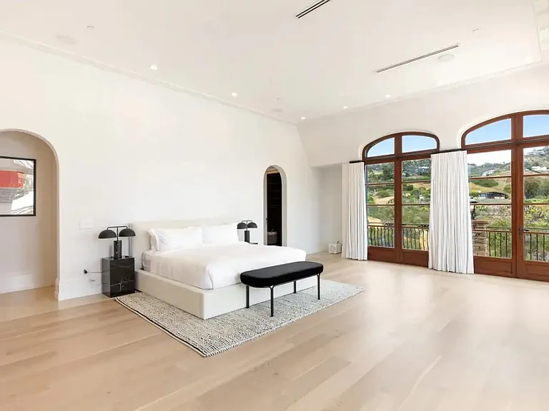 Huge primary bedroom with tall ceilings