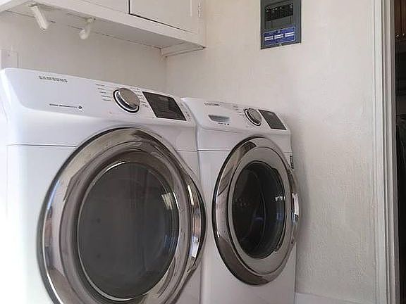 Front loading Washer and Dryer in the laundry room