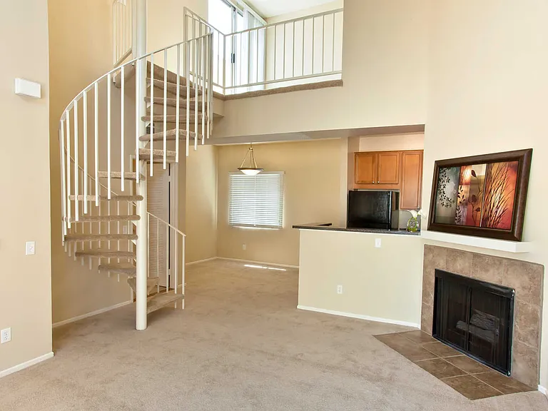 Carpeted Living Room with Fireplace