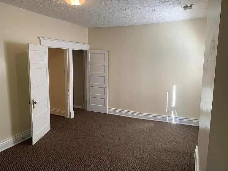 Bedroom view towards closet and hall
