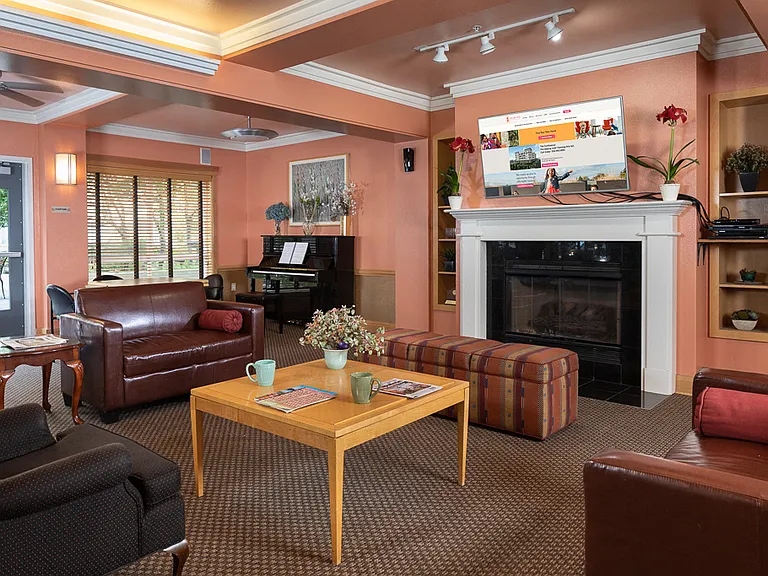 Cozy Community Room with Fireplace & TV