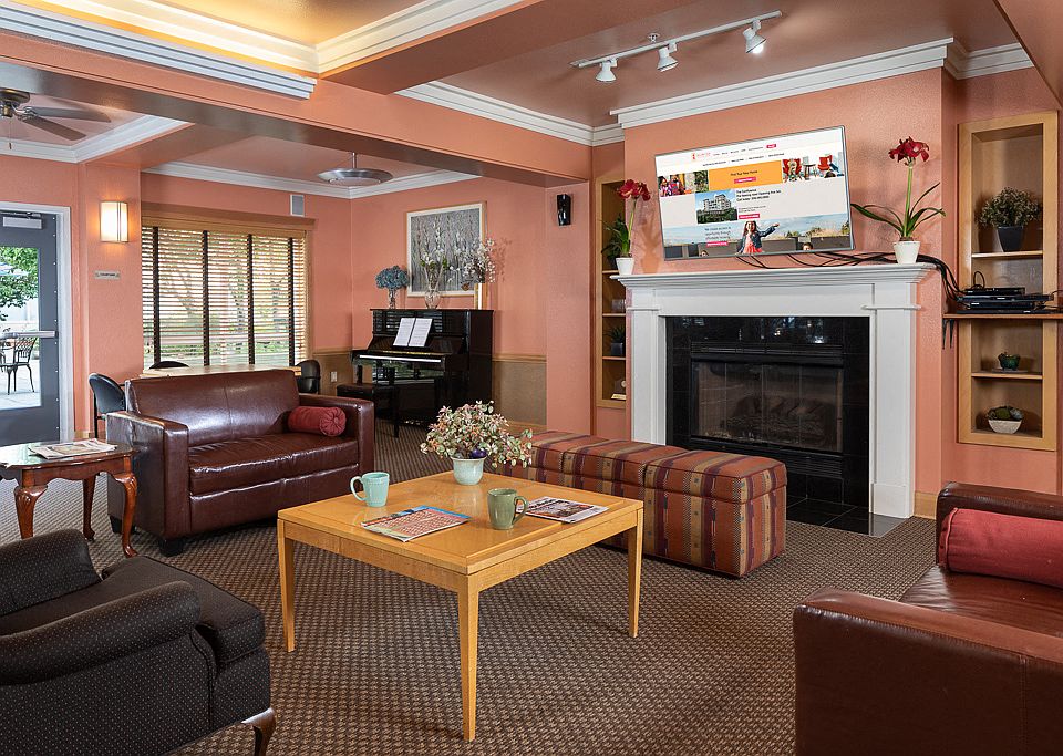 Cozy Community Room with Fireplace & TV