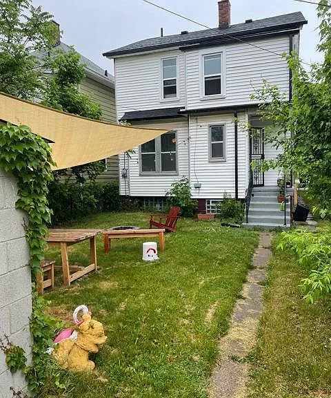 The backyard can be made into a comfortable gathering place for friends and family. Note that the furniture is not included in the lease.