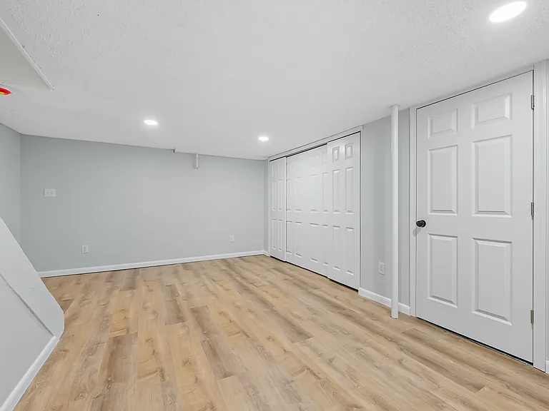 Finished basement with tons of storage.
