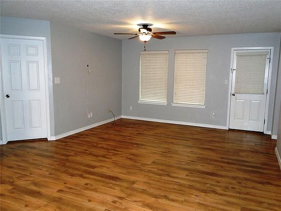 Spacious LR with Wood Laminate Flooring, New Paint, New Ceiling Fans/lights