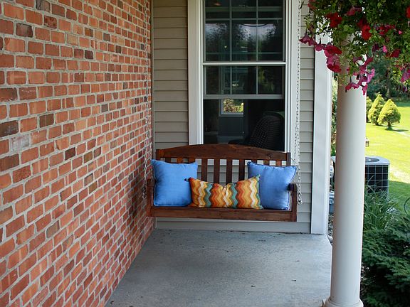 Wrap Around Porch has Swing 