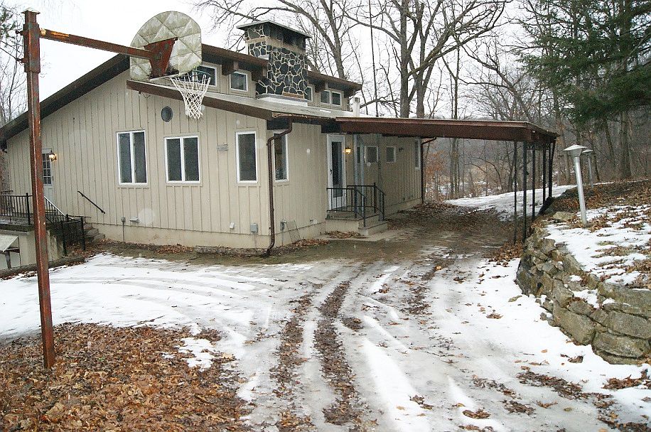 Front of house with carport