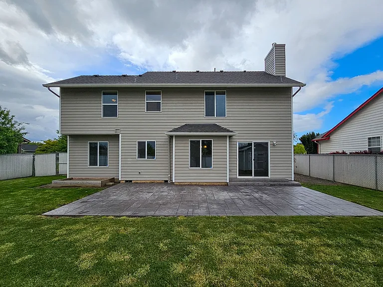 Back of house with patio