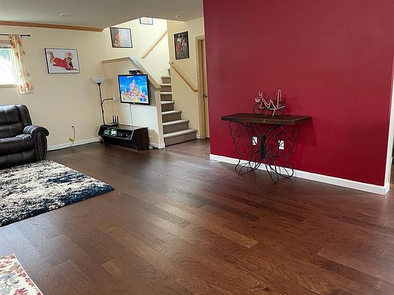 Newly painted accent wall and engineered hardwood floor.