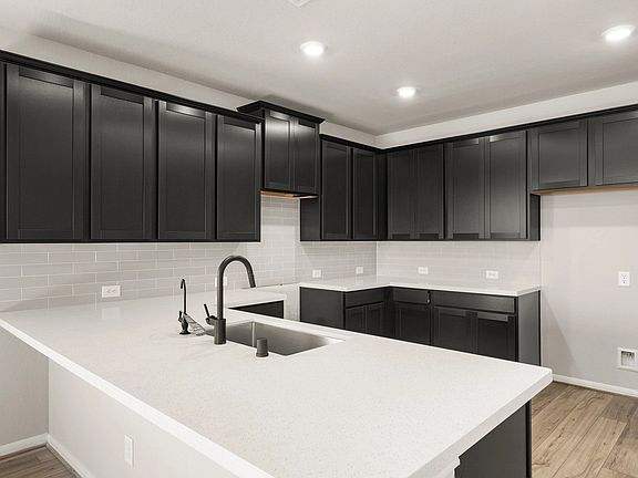 Kitchen. Note Sample product photo - actual exterior and interior selections may vary by homesite