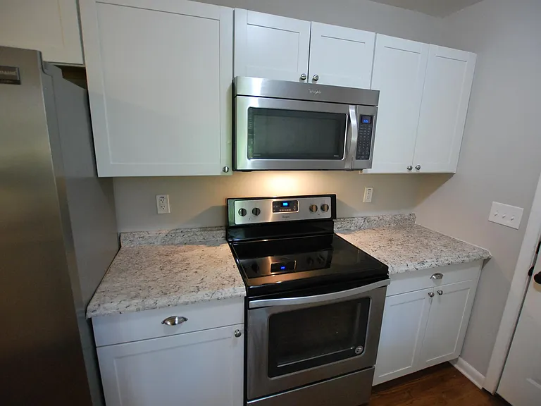 Kitchen includes range and microwave