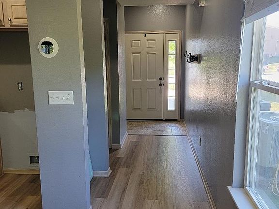 Hallway to front door from living area