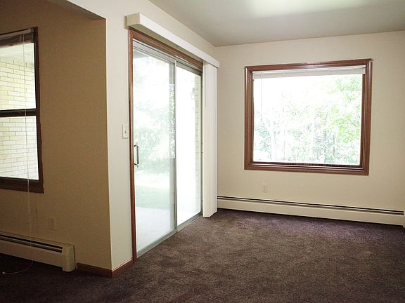 Dining Room with picture window to deer trail in backyard, large porch into back yard for grilling.