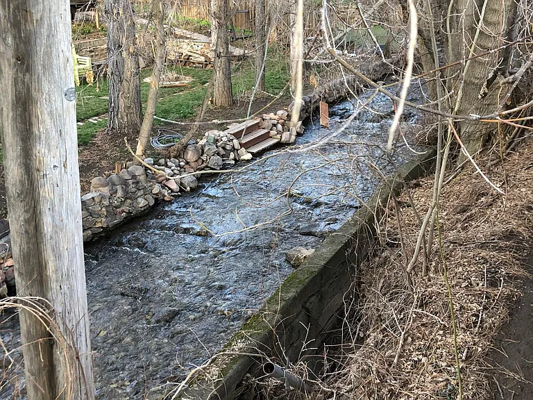 Millcreek River along the fence of the property