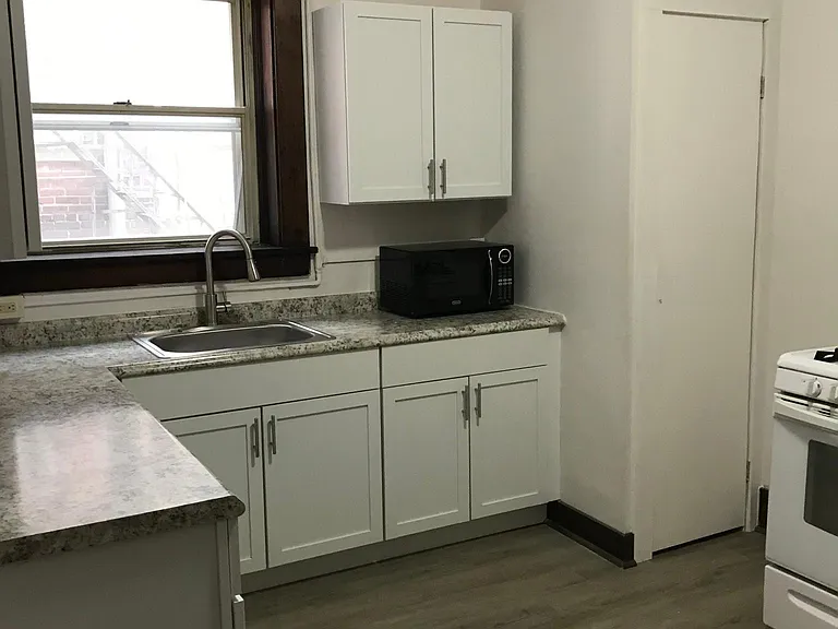 gas stove, microwave and new refrigerator included