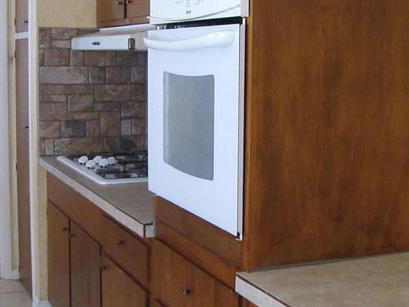 Kitchen showing cook top and oven